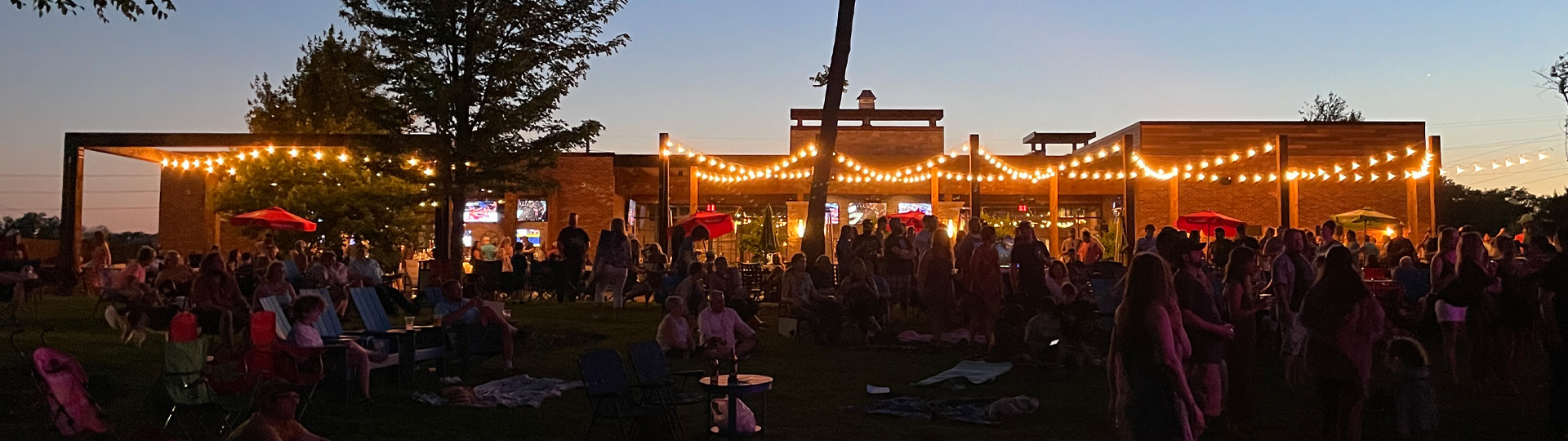 View of the backyard of The Tangled Wood with live music in the background.